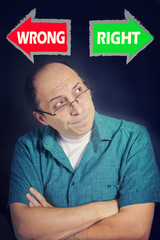 Adult man facing choice between RIGHT and WRONG