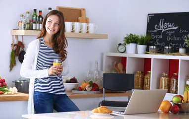 Portrait of a pretty woman holding glass with tasty juice