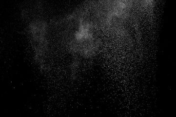abstract white dust explosion  on a black background. abstract white powder. design elements....