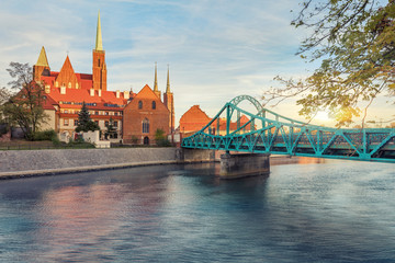 Naklejka premium Wroclaw Tumski Island bridge, vivid sunset