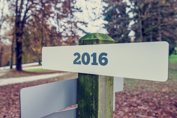 2016 sign on a wooden signboard