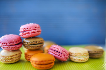 Fototapeta na wymiar Macaroons - colored almond cookies with different flavours, French delights