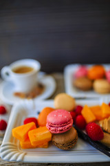 Macaroons - espresso and French dessert, colorful almond cookies with different fruit flavors