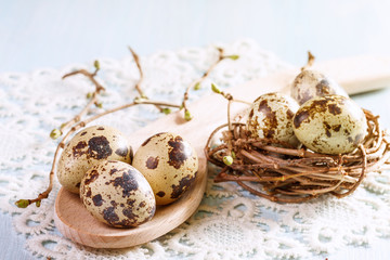 Easter eggs in a wooden spoon closeup. Toned image.