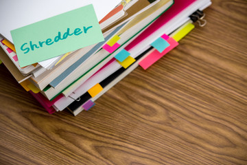 Shredder; The Pile of Business Documents on the Desk