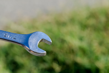 The Isolated Wrench with the Green Ground Background