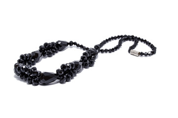 Necklace from black stone isolated on white background
