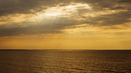 Sunset with sun rays and clouds