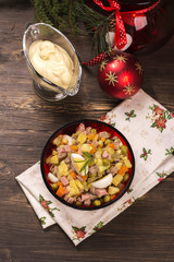 Traditional Russian salad Olivier. New Year food. Christmas background. Selective focus