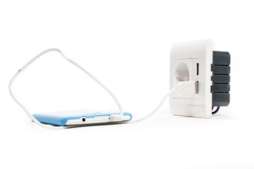 Charging. Smartphone charged from the socket, with two usb-charg