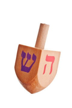 Hanukkah dreidel, isolated on white background.