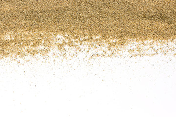 Fototapeta na wymiar closeup of a pile of sand of a beach or a desert on a white back