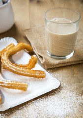 Churros with hot coffee and sugar