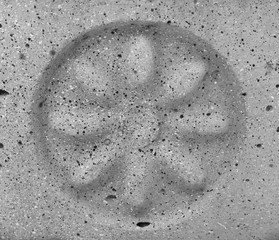 Decor flower carved on the stone wall