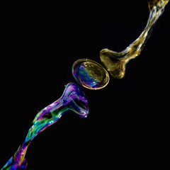 Multi-colored bubbles of liquid interconnecting with one another © andrewbretwallis