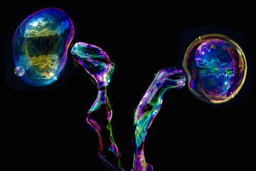 Multi-colored bubbles of liquid interconnecting with one another