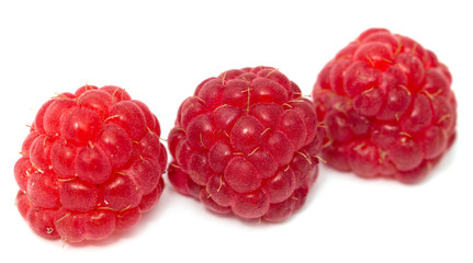 ripe raspberries on a white background