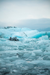 Climate change and global warming. Glacier melting in Iceland. Floating icebergs in Jokulsarlon...