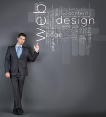 Businessman standing in front web design terms