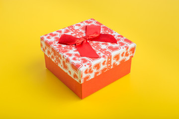 Red gift box on yellow background