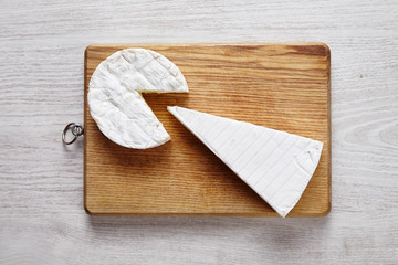 Cheese art camembert brie wooden desk white table top view