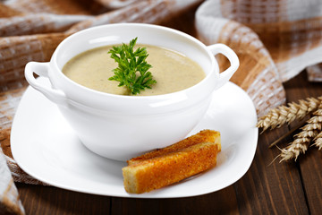 Vegetable soup with parsley and fried bread.