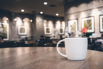 White coffee cup in coffee shop cafe