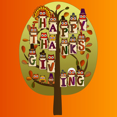 happy thanksgiving on a green tree with leaves with fall background