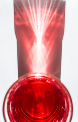 Red Soda lemonade on the table. Glass of fizzy liquid. Close up