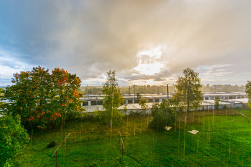 Sun and rain. Massive sky. Nature landscape. Sunset