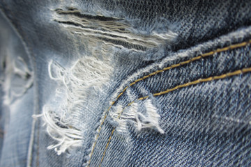 Worn blue jeans as background