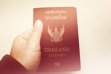 Close up of holding valid Thai passport