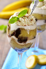 Banana trifle with chocolate sauce.