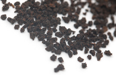 dry black tea on a white background
