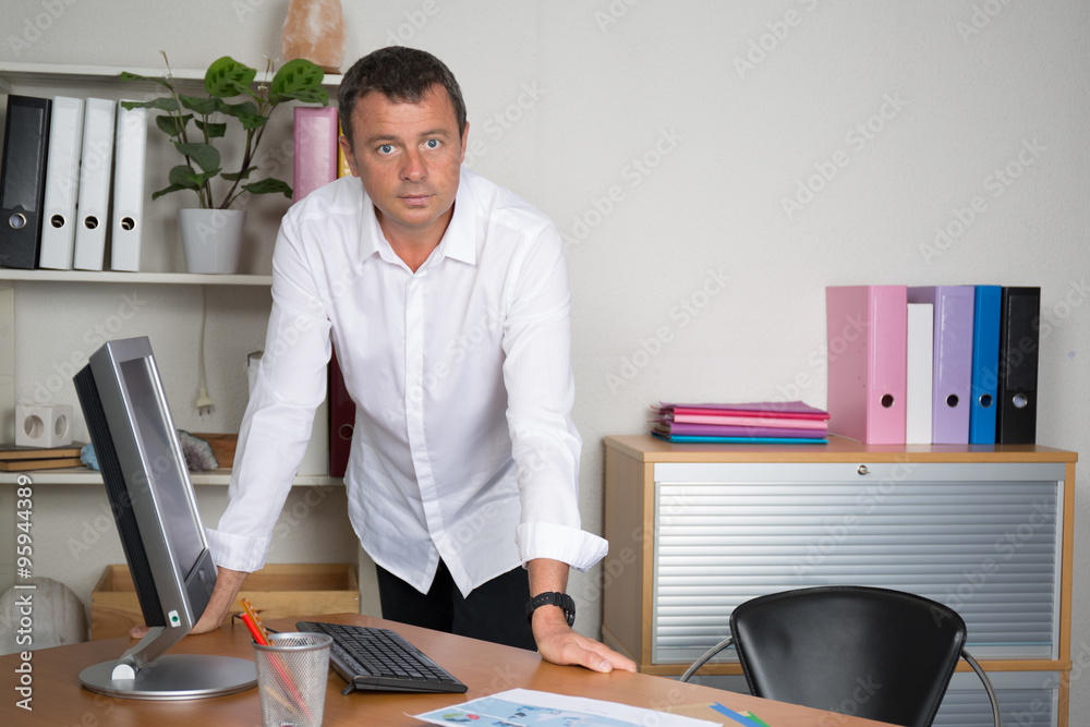 Wall mural architect standing in front of his office