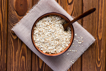 Dish of oatmeal with a spoon on a napkin