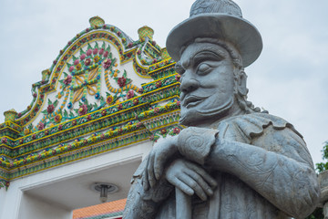Ancient statues in temple of bangkok,thailand