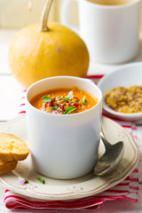 pumpkin soup in a white mug