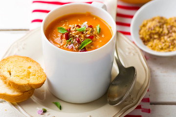 pumpkin soup in a white mug