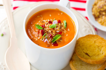pumpkin soup in a white mug
