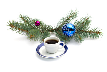 coffee and coniferous branch with New Year's scenery