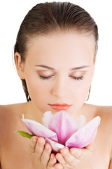 Woman with healthy clean skin and pink flowers