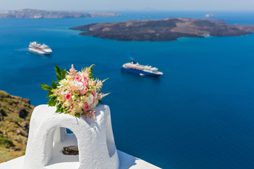 Wedding bouquet the bride on background of the sea Santorini, Greece