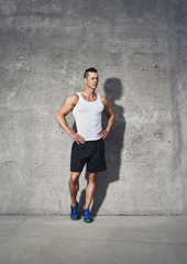 Fototapeta na wymiar Full body fitness portrait of muscular man