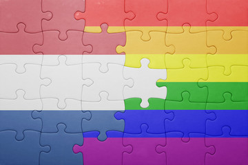 puzzle with the national flag of netherlands and gay flag