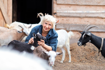 Woman farmer with goats