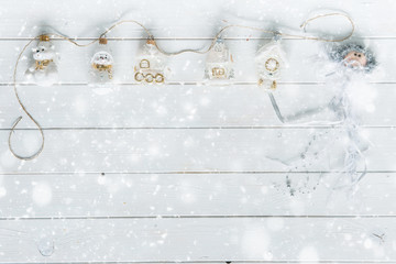 white wooden planks under snow and christmas decorations