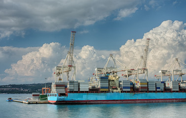 Fototapeta premium Container ship in industrial seaport of Koper in Slovenia