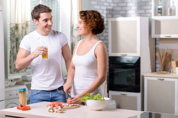 Nice couple cooking in the kitchen 