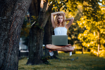 girl levitates with laptop